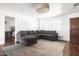 Inviting living area featuring wood floors, plush seating, and natural light from window at 6522 E 2Nd St, Scottsdale, AZ 85251