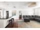 Cozy living room area with seamless kitchen access, hardwood floors, and ample natural light at 6522 E 2Nd St, Scottsdale, AZ 85251