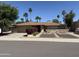 Charming single-story home featuring a well-manicured front yard and desert landscaping at 6712 E Beverly Ln, Scottsdale, AZ 85254