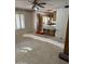 Open floorplan, with decorative wallpaper and a view into the kitchen, awaiting your unique flooring ideas at 6712 E Beverly Ln, Scottsdale, AZ 85254