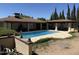 Inviting pool area with a covered patio, perfect for outdoor entertaining and relaxation at 6712 E Beverly Ln, Scottsdale, AZ 85254