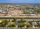 Aerial view of home showcasing its canal-side location, landscaped yard, and proximity to urban amenities at 6837 E Lafayette Blvd, Scottsdale, AZ 85251