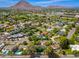Aerial view of the property with marker pin, showing the location in a lush neighborhood near desert mountains at 6837 E Lafayette Blvd, Scottsdale, AZ 85251