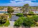 Breathtaking aerial view showcasing a home with lush landscaping, a pool, and nearby canal access at 6837 E Lafayette Blvd, Scottsdale, AZ 85251