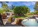 Expansive backyard featuring a spa, pool, patio and lush green lawn, perfect for entertaining at 6837 E Lafayette Blvd, Scottsdale, AZ 85251