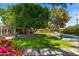 Lovely backyard featuring a sparkling pool, mature shade trees, and a meticulously maintained lawn at 6837 E Lafayette Blvd, Scottsdale, AZ 85251