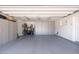 Spacious garage with epoxy floors, built-in storage cabinets, and space for multiple bikes at 6837 E Lafayette Blvd, Scottsdale, AZ 85251