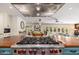 View of the kitchen with high-end gas range and a seamless flow to the living spaces at 6837 E Lafayette Blvd, Scottsdale, AZ 85251