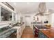 Gourmet kitchen with stainless steel appliances, granite countertops, and ample natural light at 6837 E Lafayette Blvd, Scottsdale, AZ 85251