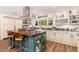 Spacious kitchen boasts a gas range, custom cabinetry, and ample counter space at 6837 E Lafayette Blvd, Scottsdale, AZ 85251