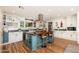 Bright kitchen with a central island, stainless steel appliances, and custom cabinetry at 6837 E Lafayette Blvd, Scottsdale, AZ 85251