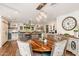 Open kitchen features a large island, modern lighting, and a dining area at 6837 E Lafayette Blvd, Scottsdale, AZ 85251