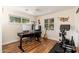 Bright office/flex space with hardwood floors, backyard views, and exercise equipment at 6837 E Lafayette Blvd, Scottsdale, AZ 85251