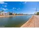 Picturesque view of a tranquil canal, showcasing waterfront living and scenic beauty at 6837 E Lafayette Blvd, Scottsdale, AZ 85251