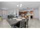 Open-concept dining area seamlessly connects the kitchen and living spaces in this home at 7343 W Hughes Dr, Phoenix, AZ 85043