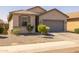 Inviting home with a well-kept yard and desert landscaping for easy maintenance at 7343 W Hughes Dr, Phoenix, AZ 85043