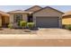 Charming single-story home with a well-maintained front yard and two-car garage at 7343 W Hughes Dr, Phoenix, AZ 85043