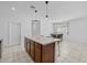 Spacious kitchen with a central island and breakfast bar seating, connecting to the dining area at 7343 W Hughes Dr, Phoenix, AZ 85043
