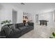 Open-concept living area with a large sectional, dining table, and an eat-in kitchen island at 7343 W Hughes Dr, Phoenix, AZ 85043