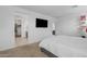 Cozy primary bedroom featuring a television and shelving, providing ample space at 7343 W Hughes Dr, Phoenix, AZ 85043