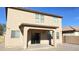The house's backyard features a covered patio, a brick wall and a privacy fence at 7425 W Crown King Rd, Phoenix, AZ 85043