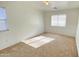 A bright bedroom features neutral carpet, blinds and natural light from windows at 7425 W Crown King Rd, Phoenix, AZ 85043