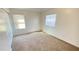 Bright bedroom with carpet flooring and plenty of natural light from windows at 7425 W Crown King Rd, Phoenix, AZ 85043