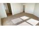 Bright bedroom with carpet flooring and an adjacent bathroom with shower at 7425 W Crown King Rd, Phoenix, AZ 85043