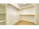 A large walk-in closet featuring ample shelving and storage space at 7425 W Crown King Rd, Phoenix, AZ 85043