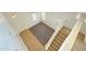 High angle view of a living room showing wood-look flooring and staircase at 7425 W Crown King Rd, Phoenix, AZ 85043