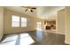Open-concept living room with new floors, lots of light and view into the kitchen at 7425 W Crown King Rd, Phoenix, AZ 85043