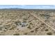 High-angle aerial exhibits the remote desert property and surrounding native landscape at 870 S La Paz Rd, Maricopa, AZ 85139
