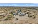 Broad aerial perspective displays the extensive land, buildings, and surrounding desert terrain at 870 S La Paz Rd, Maricopa, AZ 85139