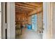 Interior of barn with hay, equipment for maintaining livestock and shelving for supplies at 870 S La Paz Rd, Maricopa, AZ 85139