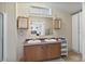 Bathroom with double sinks, vanity, and bright window at 870 S La Paz Rd, Maricopa, AZ 85139