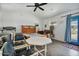 Bedroom with wood floors, ceiling fan, table, chairs and a decorative horse figure at 870 S La Paz Rd, Maricopa, AZ 85139