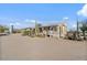 Quaint desert residence features a covered porch, providing a welcoming facade at 870 S La Paz Rd, Maricopa, AZ 85139