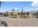 Charming single-story home features a covered porch and desert landscaping at 870 S La Paz Rd, Maricopa, AZ 85139