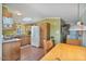 Functional kitchen with wood cabinets, ample counter space, and adjoining dining area at 870 S La Paz Rd, Maricopa, AZ 85139