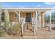 Inviting covered porch with sturdy white railing leading to a secure, metal front door at 870 S La Paz Rd, Maricopa, AZ 85139