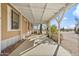 Long covered porch features sturdy beams and a shady spot to relax and enjoy outdoors at 870 S La Paz Rd, Maricopa, AZ 85139