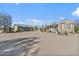 Desert home with detached structure, showcasing ample space and tranquil setting at 870 S La Paz Rd, Maricopa, AZ 85139