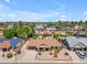 Aerial view of a single-story home showcasing landscaping, solar panels, and a two car driveway at 928 W Natal Ave, Mesa, AZ 85210