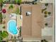 Overhead aerial view of backyard with patio, pool, and surrounding neighborhood at 928 W Natal Ave, Mesa, AZ 85210
