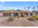 Charming single-story home featuring a well-manicured front yard and a welcoming brick accented entryway at 928 W Natal Ave, Mesa, AZ 85210