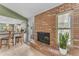 Spacious room showcasing a brick fireplace with open views to the modern eat-in kitchen at 928 W Natal Ave, Mesa, AZ 85210
