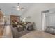 Warm living room featuring a brick fireplace, comfortable sofas, and an open layout creating a welcoming atmosphere at 928 W Natal Ave, Mesa, AZ 85210