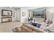 Bright and airy living room with a comfortable sofa, stylish furniture, and a large window offering ample natural light at 928 W Natal Ave, Mesa, AZ 85210