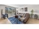 Comfortable living room with a plush sectional sofa, a large window, and tasteful decor creating a cozy atmosphere at 928 W Natal Ave, Mesa, AZ 85210