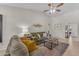 Cozy living room with vaulted ceilings, neutral paint, comfortable seating and a decorative accent wall at 928 W Natal Ave, Mesa, AZ 85210